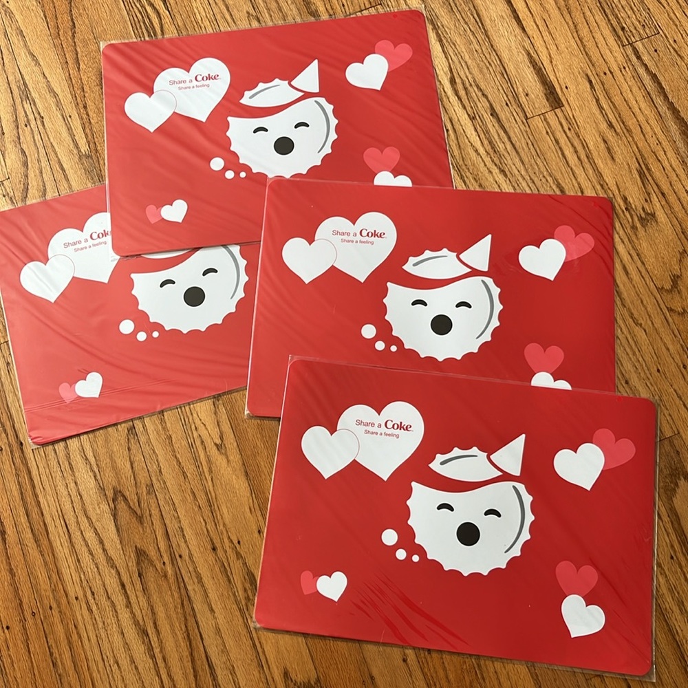 4 pc of Coke placemats